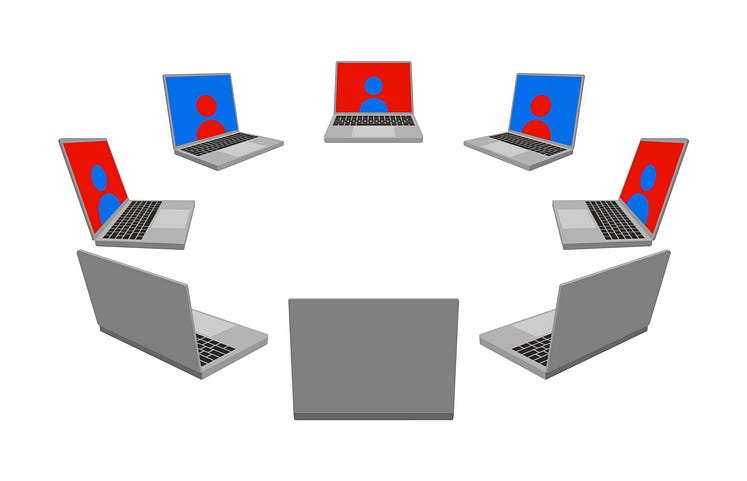 A circle of laptops facing each other, each projecting an avatar on screen.