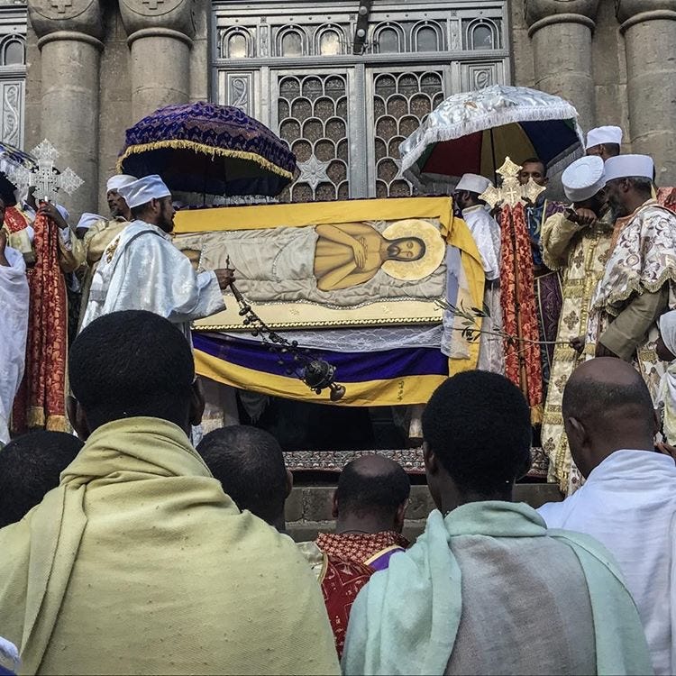 @maile_tadese: Priest moves censer with burning incense on the symbolic dead body of Christ. 