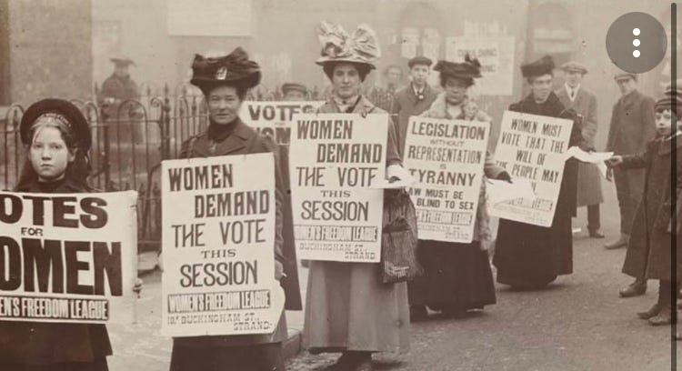 Women protesting for the vote with voter rights signs in London 100 years ago.