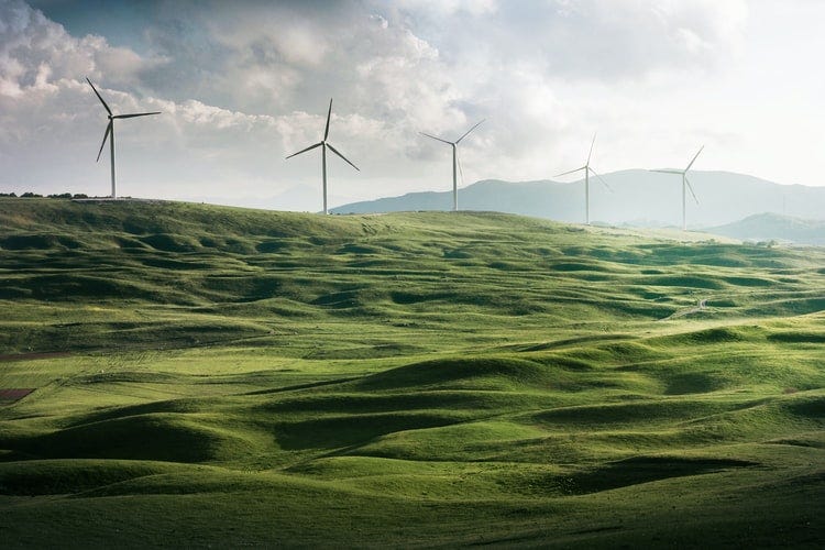 Windmills on mountain or a hill.