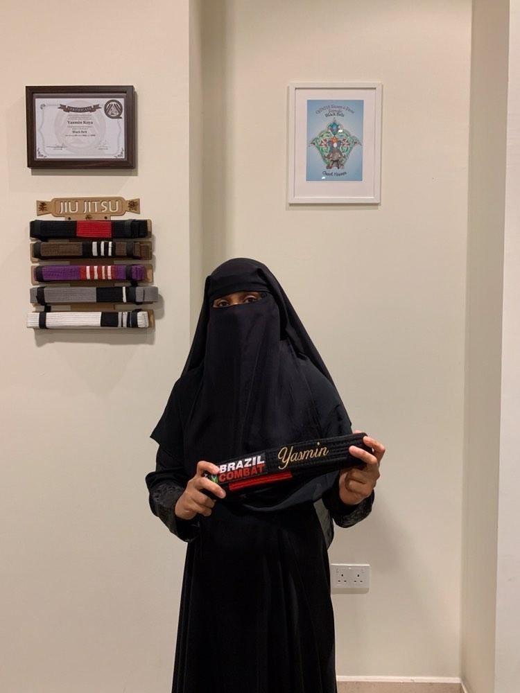 Muslim woman black belt martial arts