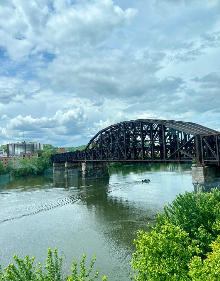 Picture of an elevator to the conference floor and a railway bridge in Pittsburgh 