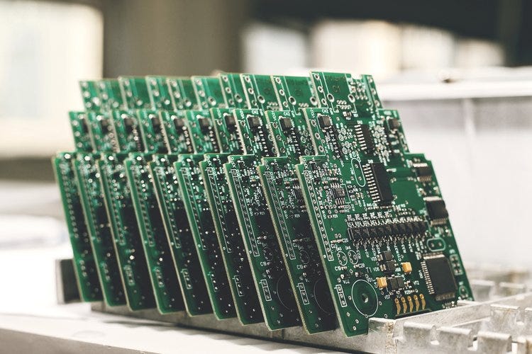These circuitboards are part of the first successful production run for this particular PCB. If they pass inspection, these boards will be some of the first to be boxed and shipped.