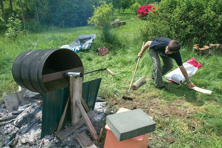 Lloyd adding wood to a barrel