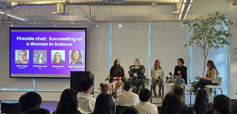 Picture: Lyft DIG members hosting a Women in Science cross-company conference at the Lyft office, including technical talks and a panel discussion