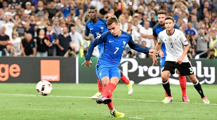France's Antoine Griezmann scores the opening goal from the penalty spot during the Euro 2016 semifinal soccer match between Germany and France, at the Velodrome stadium in Marseille, France, Thursday, July 7, 2016. (AP Photo/Martin Meissner)