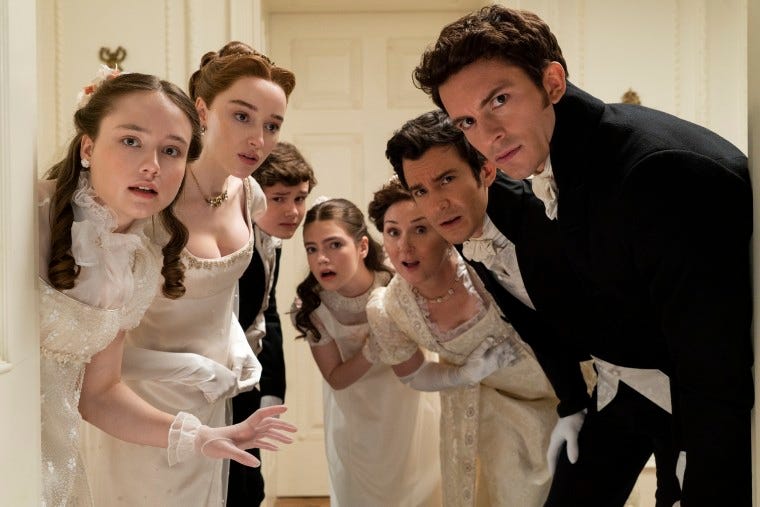 An image shows the Bridgerton Season 2 cast peeping into the camera as if peeping into a room. They are all in black and white period clothing. They have expressions ranging from surprised to frustrated.
