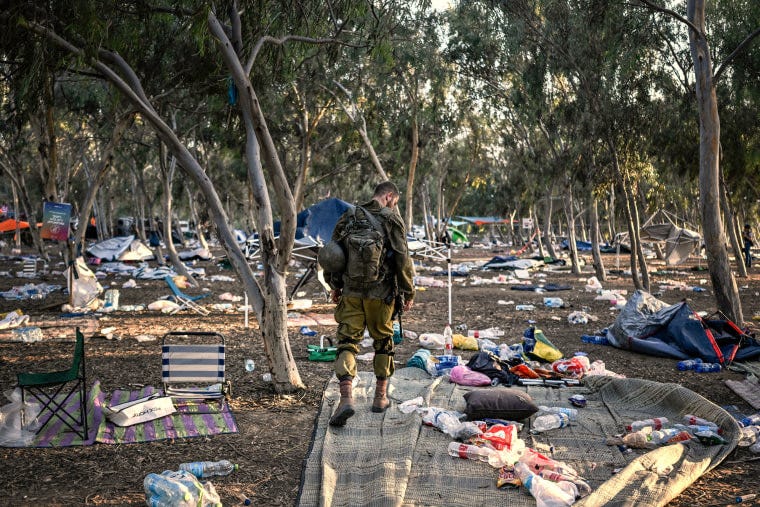 Israeli soldier at Supernova music festival attack site in Be’eri.