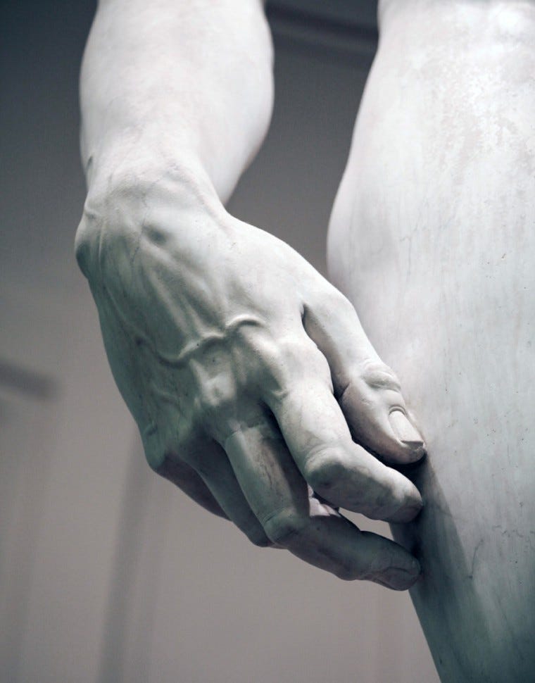 A close-up shot of the hand of the sculpture Michelangelo's David sculpture
