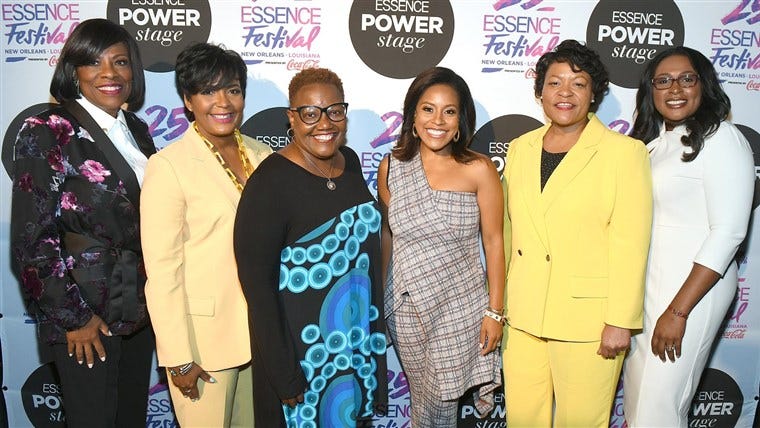 A photo containing several black women mayors.