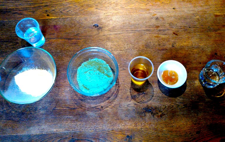 Ingredients for cooking flour paint on an old wooden table.