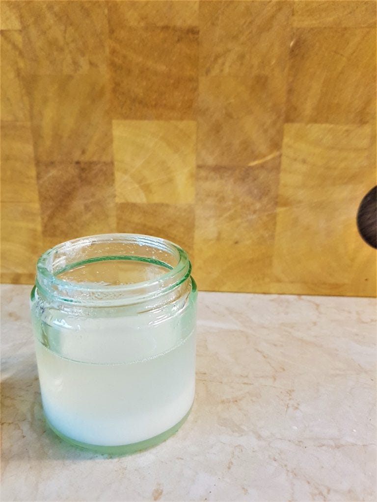 Homemade toothpaste with coconut oil still warm