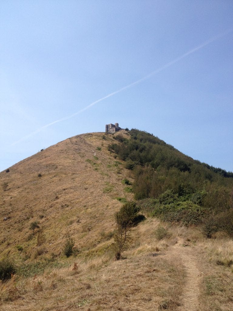 The view back up towards Fort Diamante from the descent to Trenasco station. All in the Parco Della Mura in Genova, Italy.