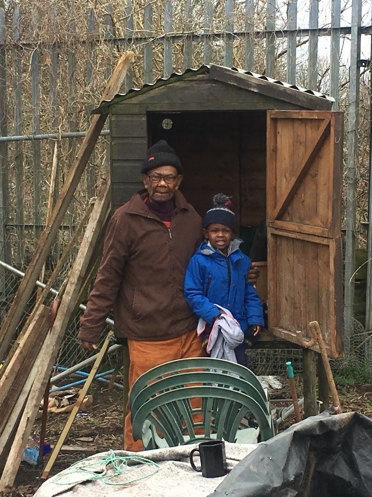 An image of an elderly black man (my dad) and a young black boy (his grandson)