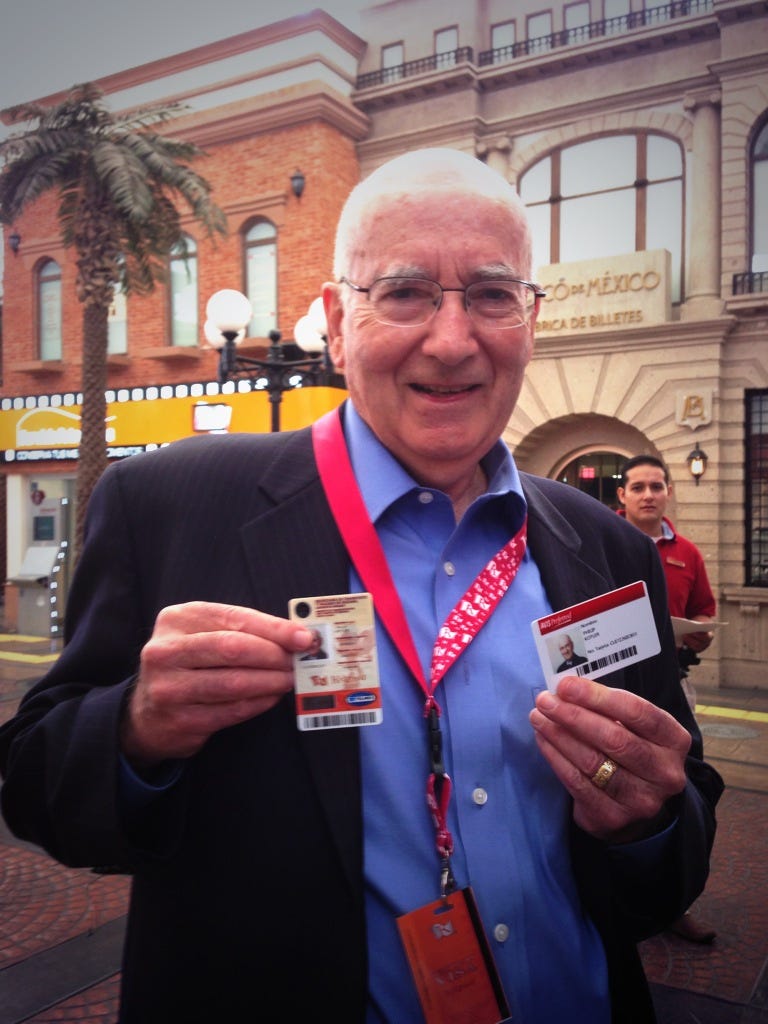 Prof. Philip Kotler proudly shows his driving license before jumping in a car and driving through the streets of KidZania Cuicuilco.