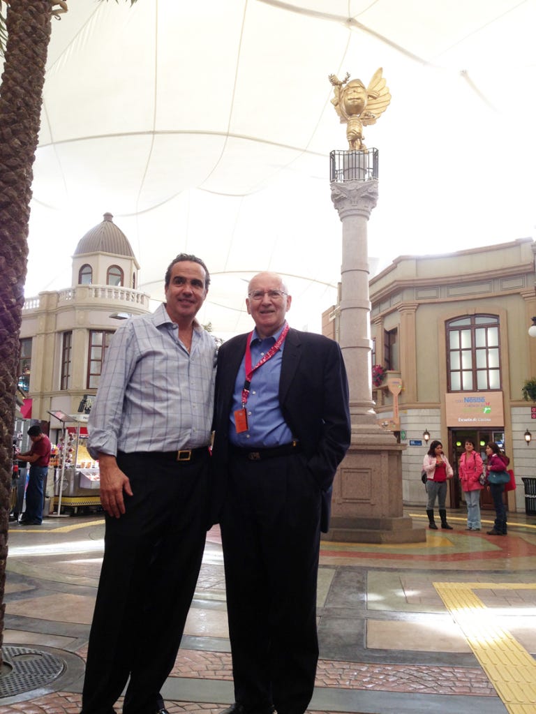 Xavier Lopez and Philip Kotler in front of one of the landmark monuments of KidZania Cuicuilco