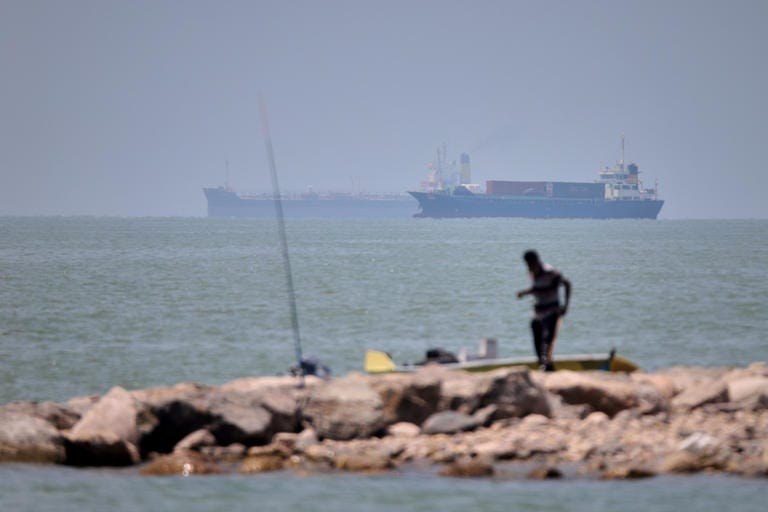 Iranian drone attack on Bahrain reported as ship struck in Strait of Hormuz