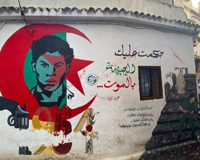 Mural outside the Ali la Pointe memorial.