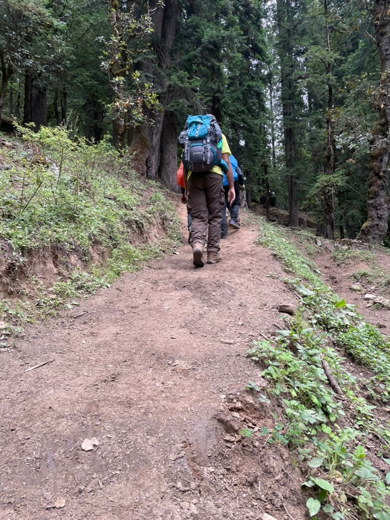 Trekkers walking uphill.