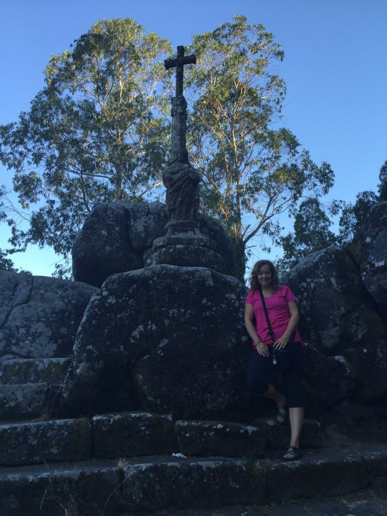 Michelle standing in Padron, Spain, on the spot where St. James gave sermons