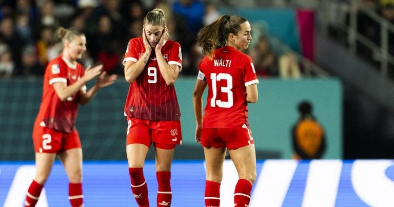 photo of Switzerland players looking sad
