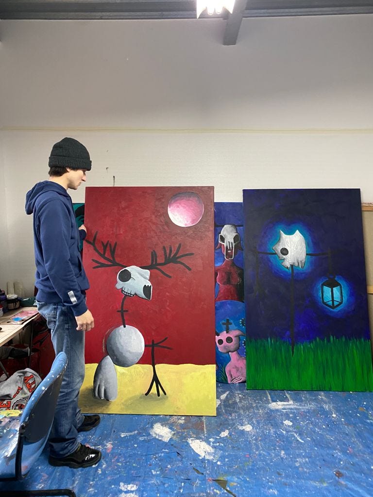 Sebastien Delbes in front of his artwork in his atelier