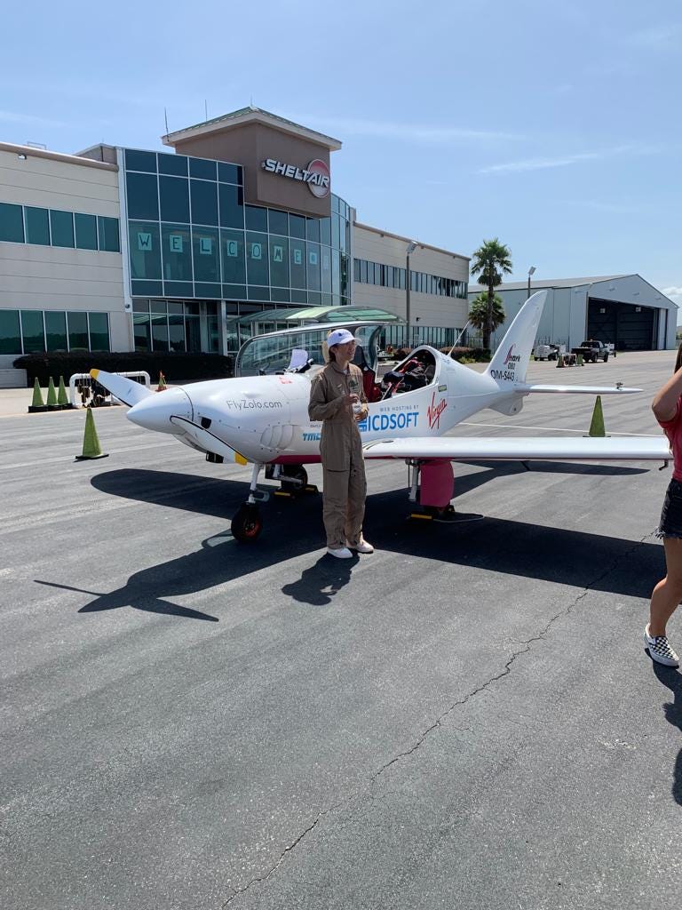 Zara and her glider on the runway in Jacksonville, Fla.