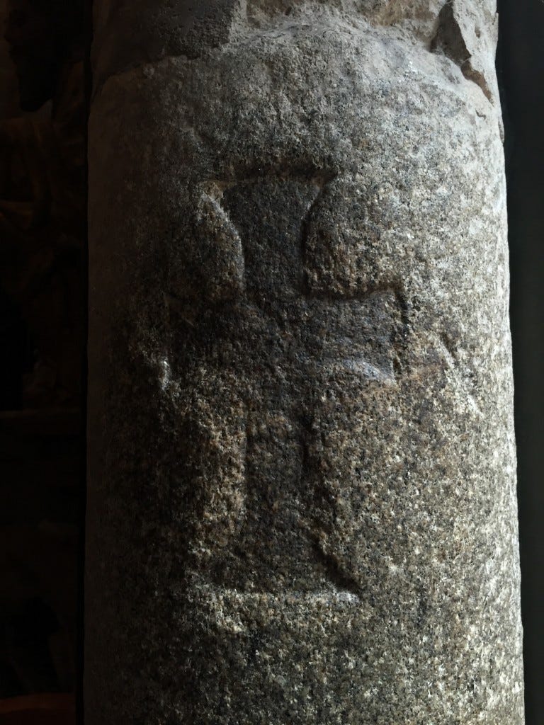 A very old carving of the Saint James Cross, in a stone pillar
