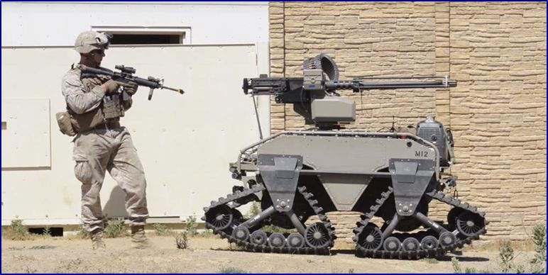 Human soldier with robotic soldier looking like a small tank with a gun.