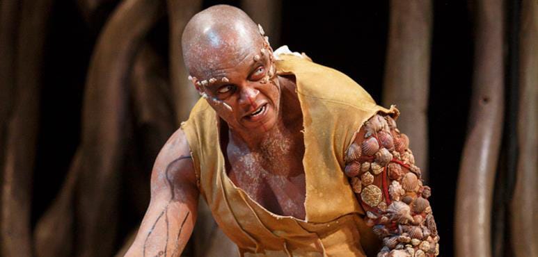 Caliban in the 2018 Stratford Theatre Festival performance of The Tempest. Various sea shells cover his entire left arm and some of his face.