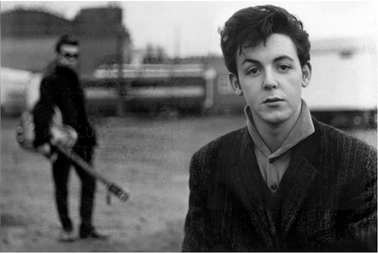 Paul McCartney and Stuart Sutcliffe in the background. Photo by Astrid Kirchherr.