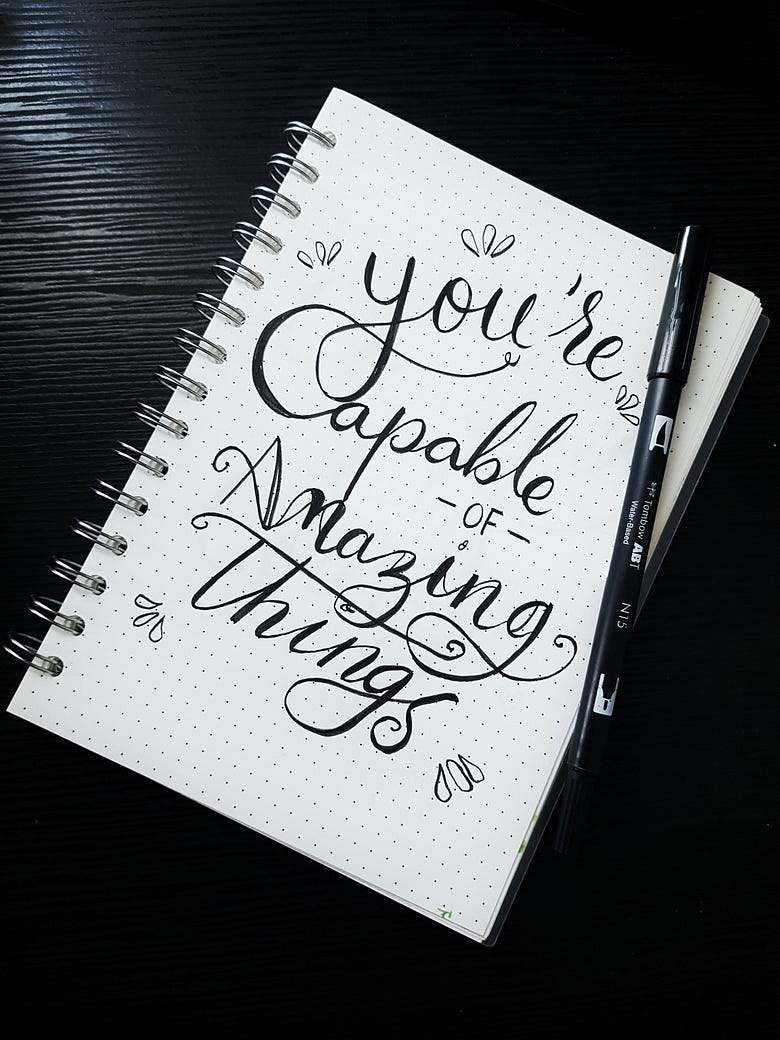 A notebook saying you’re capable of amazing things