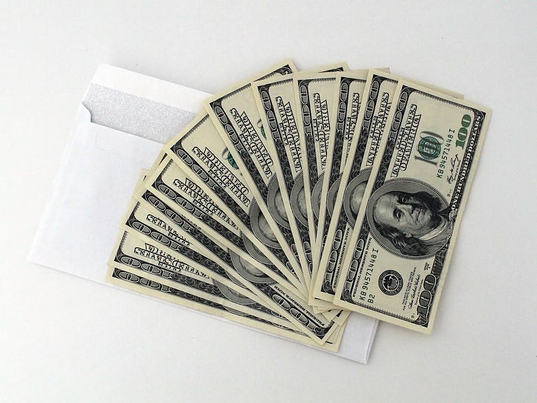 An envelope with cash showing Substack potential.