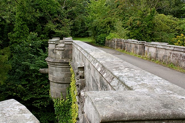 A long view of the stone Overtoun Bridge