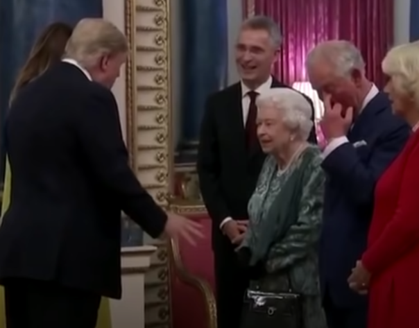 Prince Charles giving the middle finger to Trump