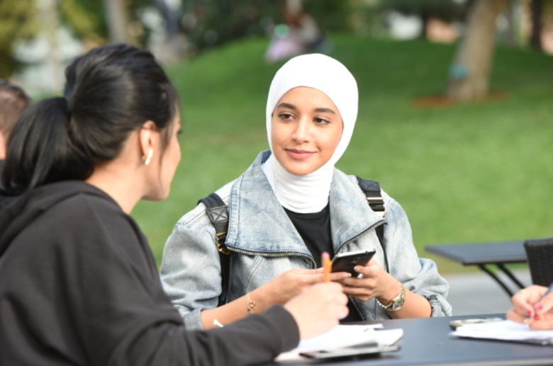 Picture of a Muslim woman sitting down