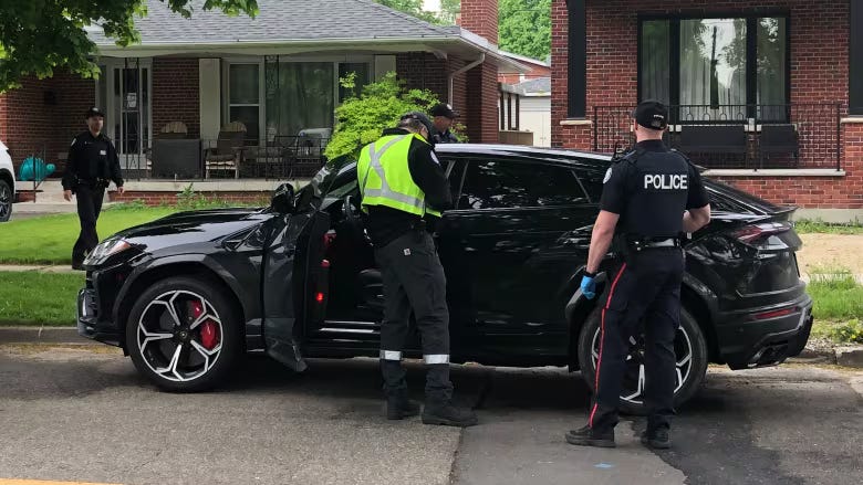 Toronto Police Services recovering a stolen black SUV.