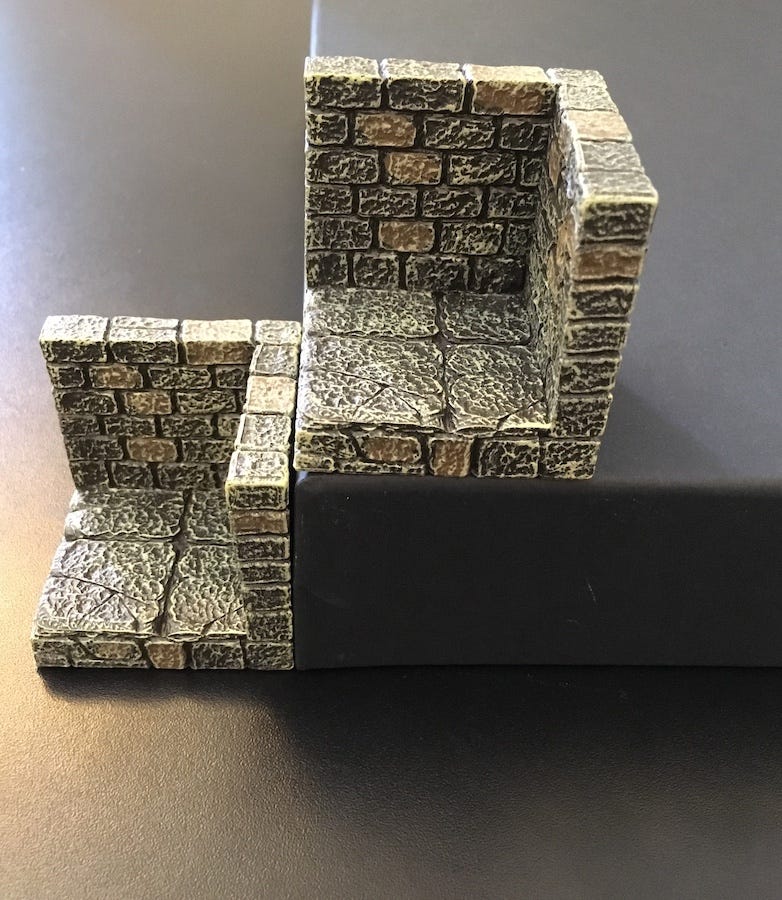 A Dwarvenforge wall+floor piece sits beside a GRÅSIDAN paper tray turned upside down. They are the same height.