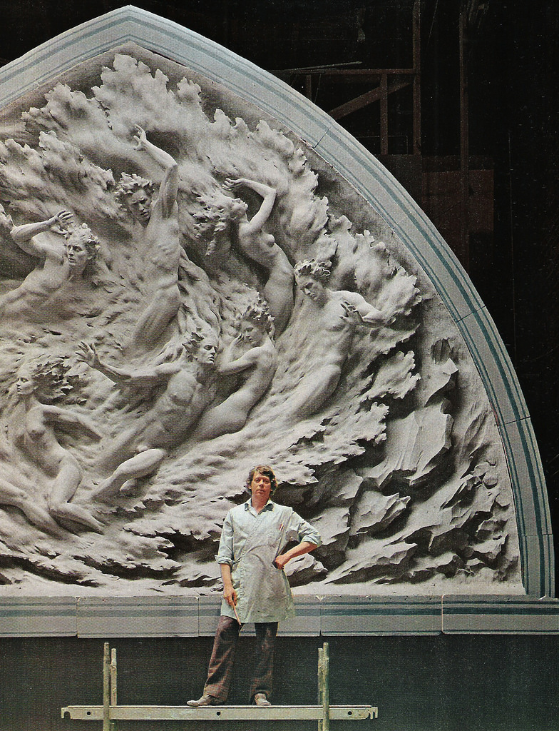 Frederick E. Hart standing in front of his sculpture Ex Nihilo