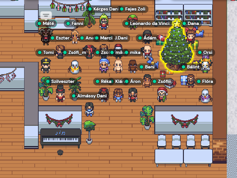 Christmas party at Gather. A lot of avatars standing around a Christmas tree.
