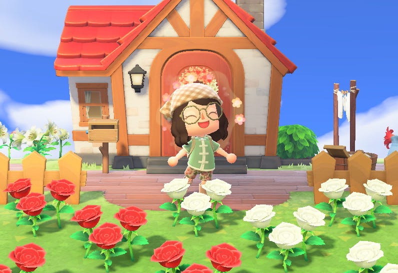 An Animal Crossing avatar blushing happily in front of their home behind a bed of roses.