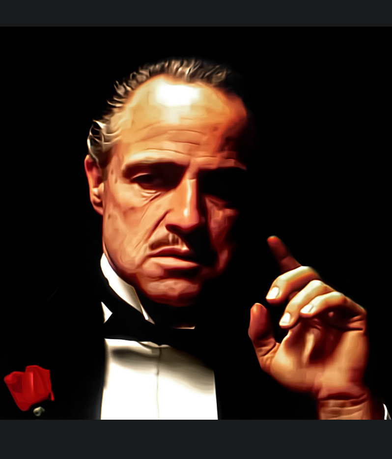 The Godfather — Marlon Brando in smoking suit raising his hand to the level of his face.