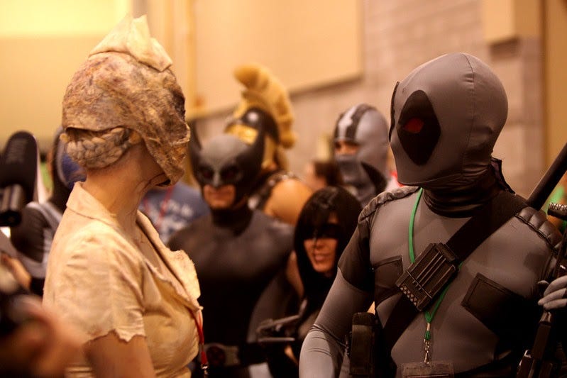 Cosplayers mingle at an event.