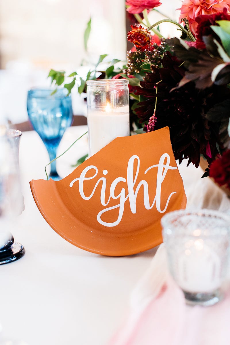 terracotta table numbers - http://ruffledblog.com/fiesta-inspired-san-diego-wedding