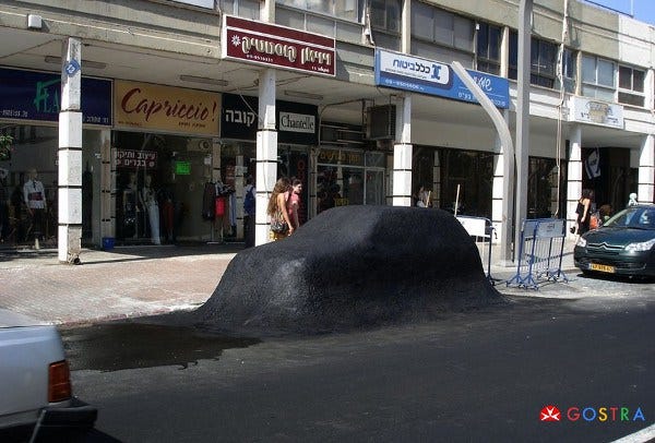 Car covered with asphalt