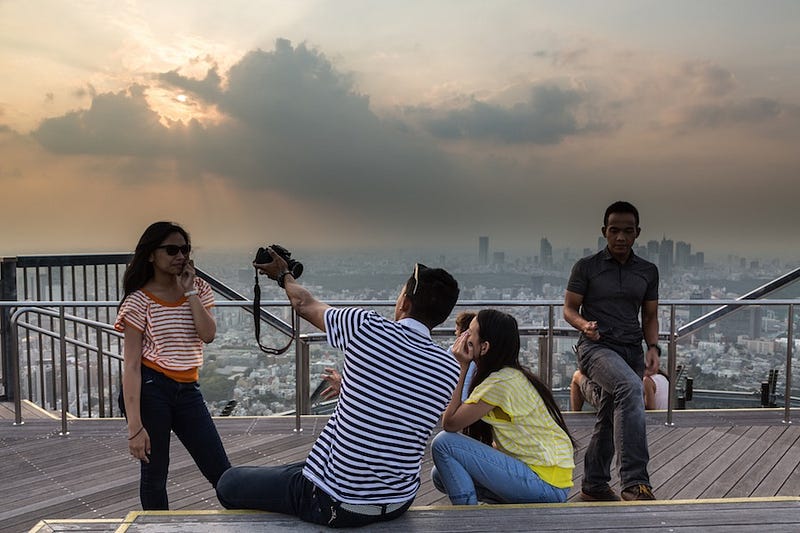 Tourists take photos ontop of Mori Tower’s Sky Deck