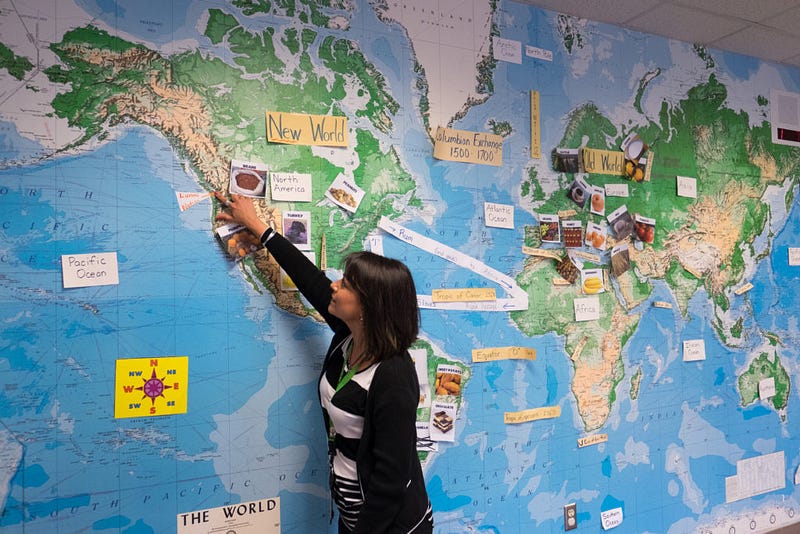 Jessica LaFortune points to the location of the Lummi Nation on her large-scale map in her classroom at the Lummi Nation School. After a challenging adjustment period during her first year, LaFortune feels that she has now established trust with her students.