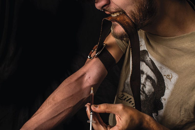 Man injecting heroin in his arm