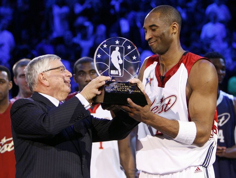 Former NBA Commissioner David Stern presents Kobe Bryant with the All-Star Game MVP in 2007.