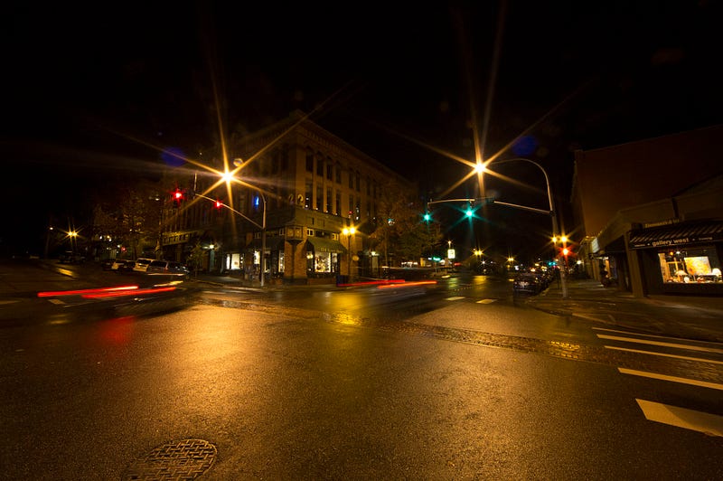 Cars rush past Sycamore Square on the corner of Harris Avenue and 12th Street in Fairhaven. Taimi Goreman, author of Haunted Fairhaven, conducted investigations for ghosts in this building and others in the neighborhood. 